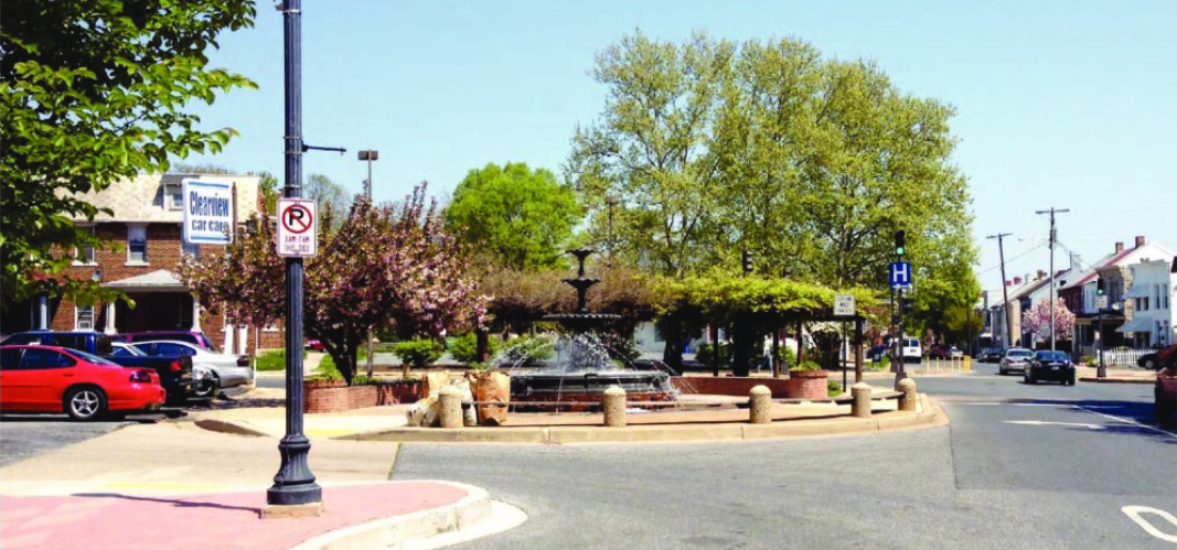 Black water fountain in center of traffic circle